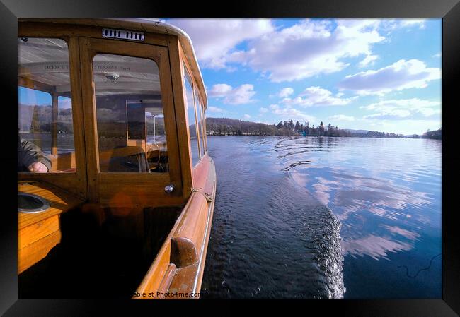 Wooden boat cruising on Windermere, Lake Distict. Framed Print by Phil Brown