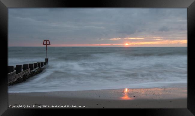 Sun reflecting on Swanage beach at dawn, Dorset, E Framed Print by Paul Edney