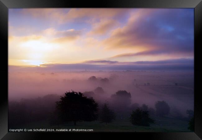 Sunrise over The Somerset levels Framed Print by Les Schofield