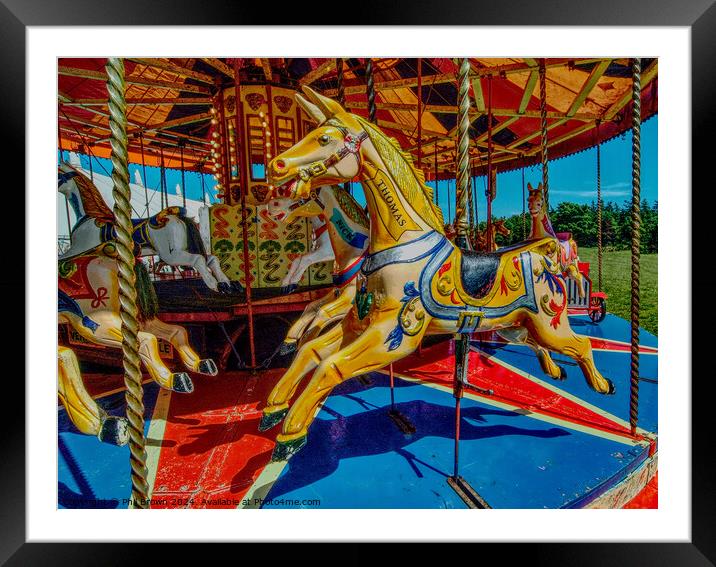 Gallopers on a carousel ride. Framed Mounted Print by Phil Brown