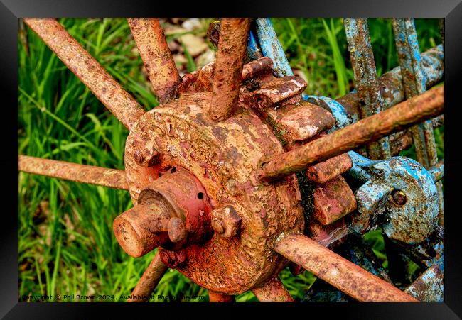 Very rusty horse drawn, hay rake wheel hub. Framed Print by Phil Brown