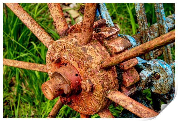 Very rusty horse drawn, hay rake wheel hub. Print by Phil Brown