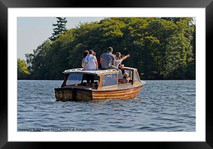 Family on small wooden motor launch, Windermere, Lake District. Framed Mounted Print by Phil Brown