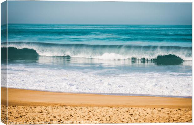 Wave breaking to the beach, intentionnal grain Canvas Print by Laurent Renault