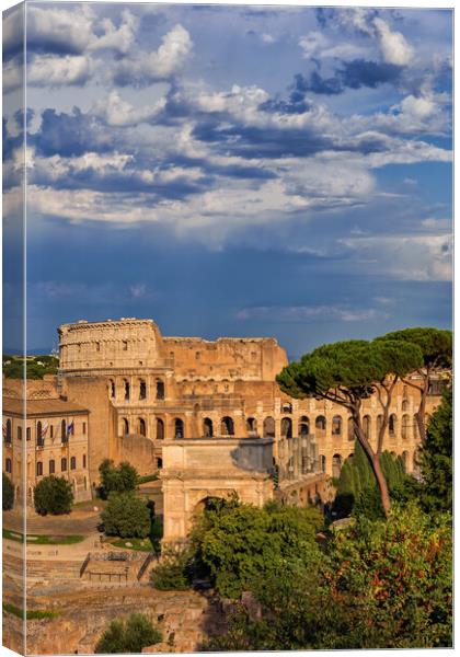 Colosseum and Arch of Titus in Rome Canvas Print by Artur Bogacki