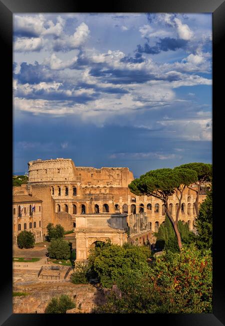 Colosseum and Arch of Titus in Rome Framed Print by Artur Bogacki