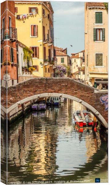 The back canals of Venice  Canvas Print by Les Schofield