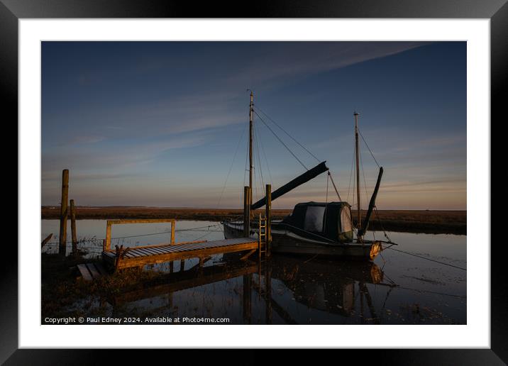 Boat at jetty in calm morning light Framed Mounted Print by Paul Edney