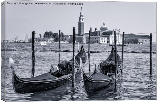 Gondolas on waterfront promenade in Venice (B&W) Canvas Print by Angus McComiskey