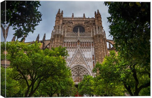 Seville Cathedral From Orange Trees Courtyard Canvas Print by Artur Bogacki