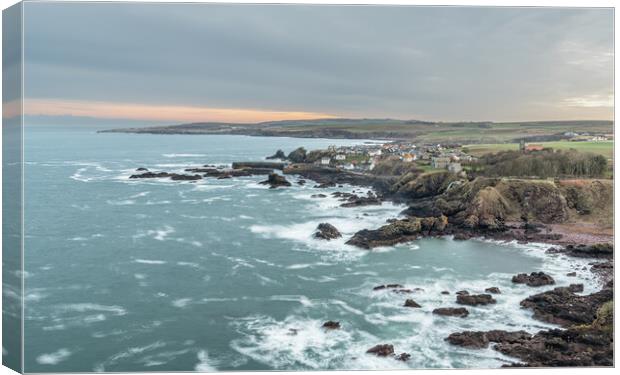 Long exposure of the sea, rocky coastline, Town and Harbour, St Abbs, Scotland Canvas Print by Dave Collins