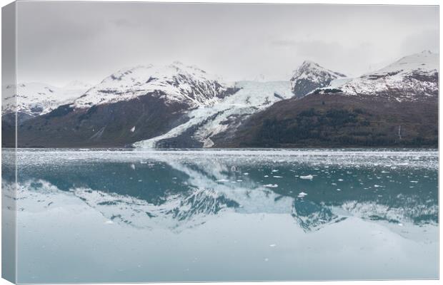A small Tidal Glacier reflected in the calm waters of College Fjord, Prince William Sound, Alaska, USA Canvas Print by Dave Collins