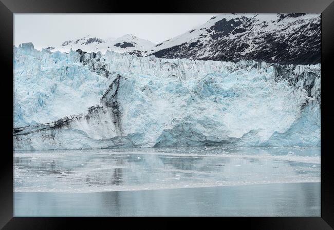 The ice and moraines at the front of a glacier, Alaska, USA Framed Print by Dave Collins
