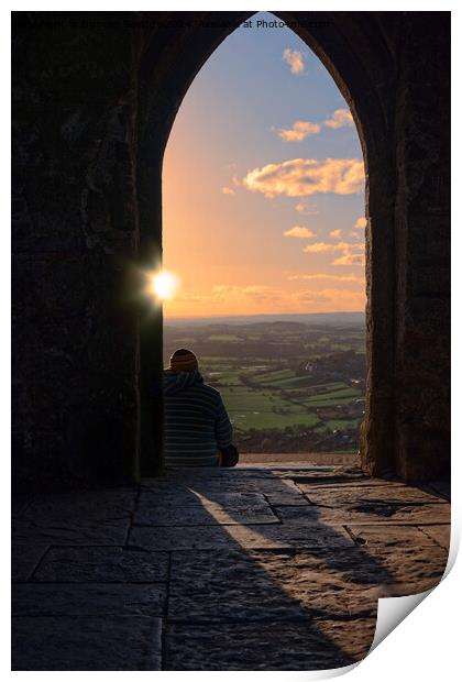 Sunset through the arch at Glastonbury Tor Print by Duncan Savidge