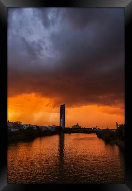 Storm Clouds Above Guadalquivir River In Seville Framed Print by Artur Bogacki