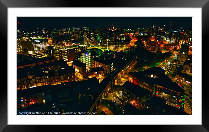 Aerial night view of a vibrant cityscape with illuminated streets and buildings in Leeds, UK. Framed Mounted Print by Man And Life