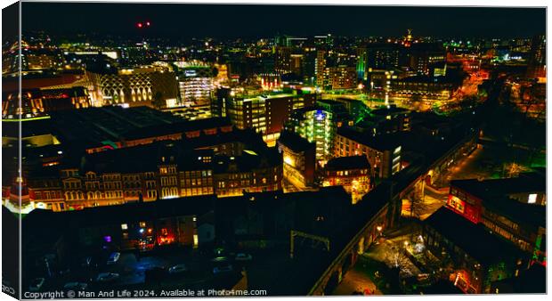 Cityscape at night with illuminated buildings and streets in Leeds, UK. Canvas Print by Man And Life