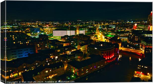 Aerial night view of a vibrant cityscape with illuminated buildings and streets in Leeds, UK. Canvas Print by Man And Life