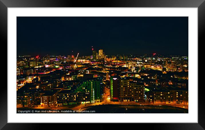 Panoramic night view of a vibrant cityscape with illuminated buildings and streets in Leeds, UK. Framed Mounted Print by Man And Life