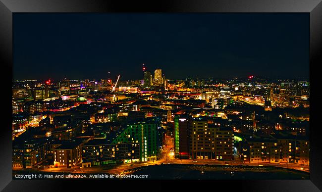 Panoramic night view of a vibrant cityscape with illuminated buildings and streets in Leeds, UK. Framed Print by Man And Life