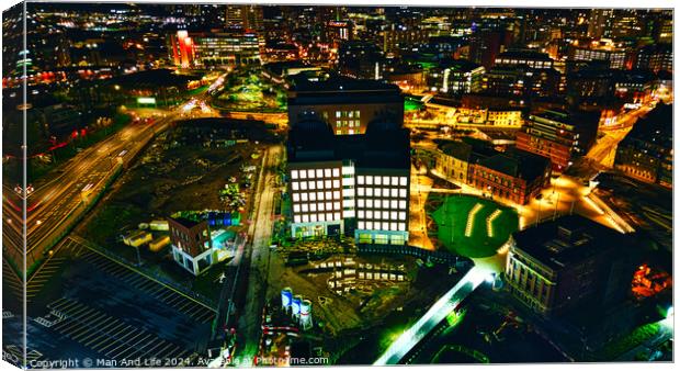 Aerial night view of an illuminated urban office building amidst city lights in Leeds, UK. Canvas Print by Man And Life