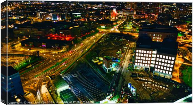 Aerial night view of a vibrant cityscape with illuminated streets and buildings in Leeds, UK. Canvas Print by Man And Life