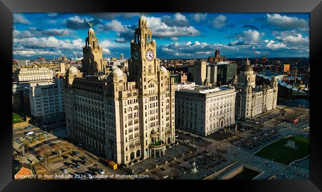Aerial view of historic urban architecture with iconic buildings under a cloudy sky in Liverpool, UK. Framed Print by Man And Life