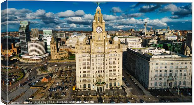 Aerial view of a historic clock tower and surrounding buildings under a cloudy sky in Liverpool, UK. Canvas Print by Man And Life