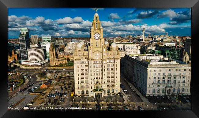Aerial view of a historic clock tower and surrounding buildings under a cloudy sky in Liverpool, UK. Framed Print by Man And Life