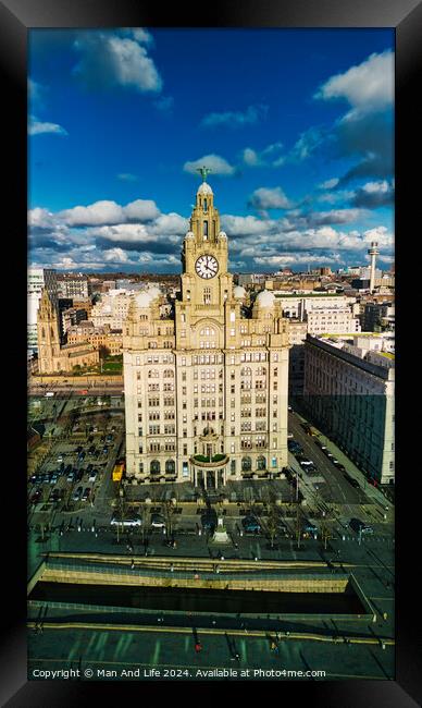 Aerial view of the historic Royal Liver Building in Liverpool, UK, with dramatic clouds in the sky. Framed Print by Man And Life