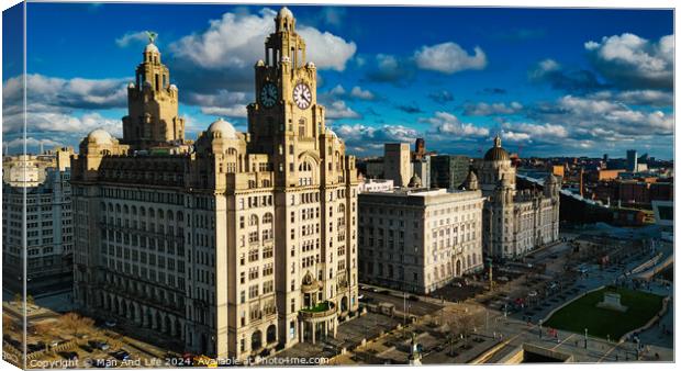 Dramatic skyline with historic buildings under a cloudy blue sky in Liverpool, UK. Canvas Print by Man And Life