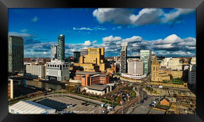 Panoramic cityscape with modern skyscrapers under a blue sky with fluffy clouds in Liverpool, UK. Framed Print by Man And Life
