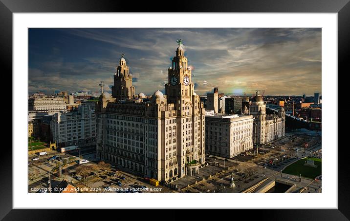 Dramatic skyline of Liverpool with iconic Liver Building at sunset, showcasing the city's architecture and urban landscape. Framed Mounted Print by Man And Life