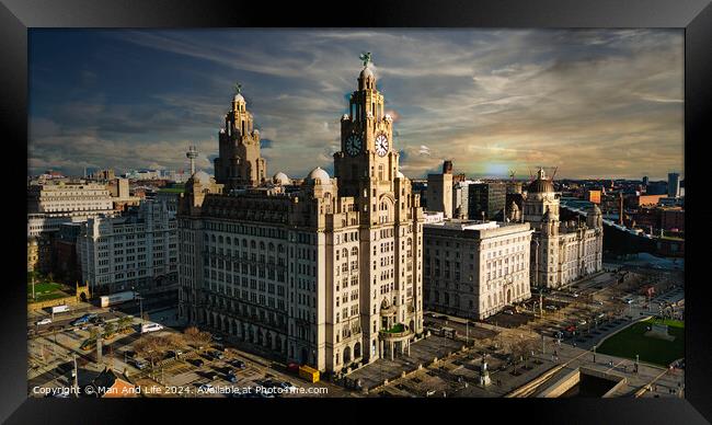 Dramatic skyline of Liverpool with iconic Liver Building at sunset, showcasing the city's architecture and urban landscape. Framed Print by Man And Life