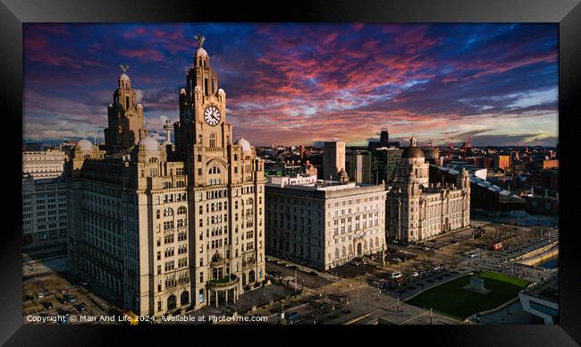 Aerial view of iconic Liverpool waterfront buildings at sunset with dramatic sky. Framed Print by Man And Life