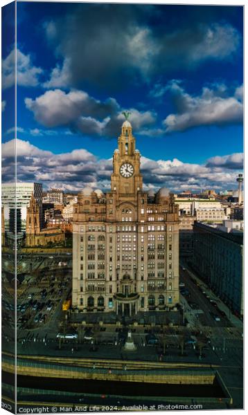 Dramatic sky over historic clock tower building in urban landscape in Liverpool, UK. Canvas Print by Man And Life