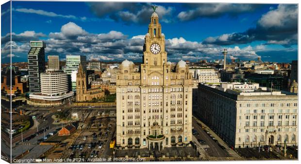 Aerial view of the iconic Royal Liver Building in Liverpool, UK, with dramatic clouds in the sky. Canvas Print by Man And Life
