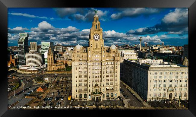 Aerial view of the iconic Royal Liver Building in Liverpool, UK, with dramatic clouds in the sky. Framed Print by Man And Life