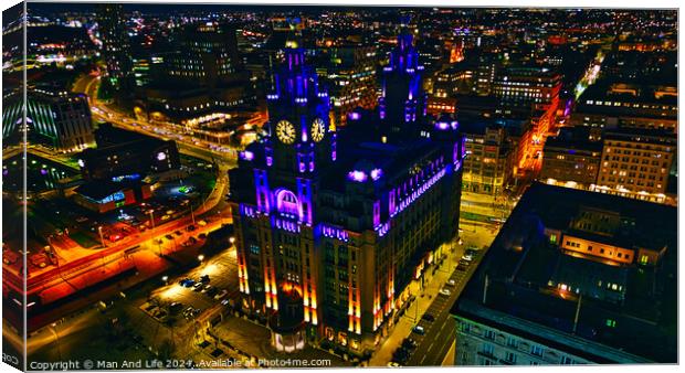 Illuminated historic building at night in urban skyline in Liverpool, UK. Canvas Print by Man And Life