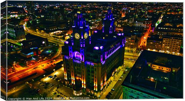 Illuminated historic building at night in urban skyline in Liverpool, UK. Canvas Print by Man And Life