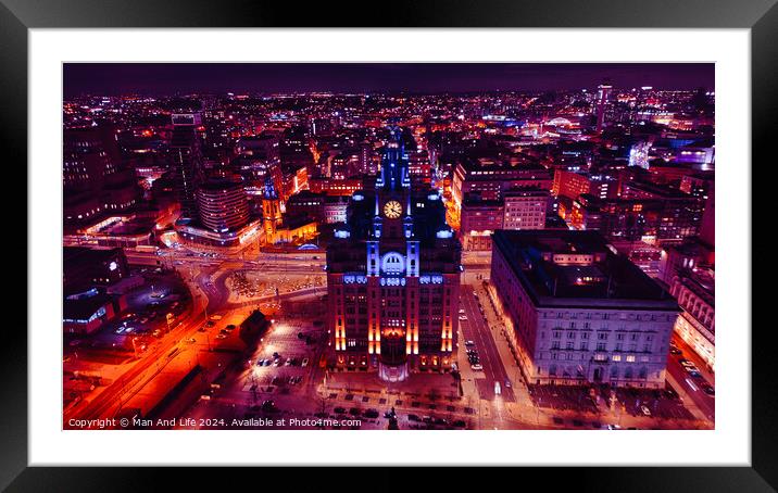 Aerial night view of a cityscape with illuminated buildings and streets, showcasing urban architecture and vibrant city life in Liverpool, UK. Framed Mounted Print by Man And Life