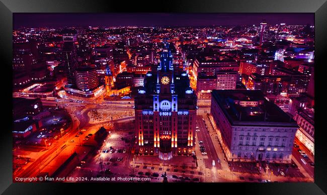 Aerial night view of a cityscape with illuminated buildings and streets, showcasing urban architecture and vibrant city life in Liverpool, UK. Framed Print by Man And Life