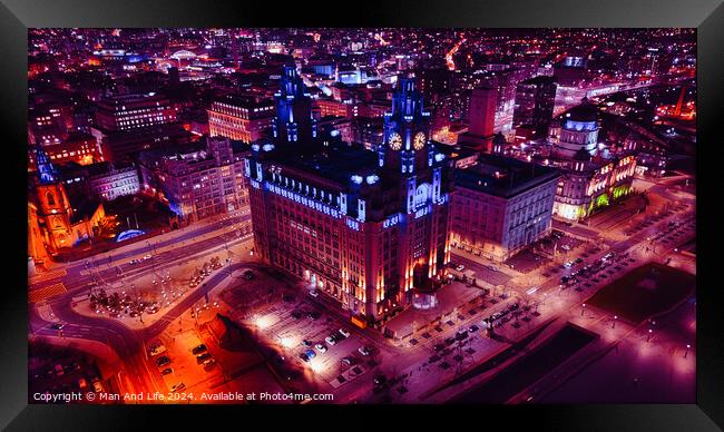 Aerial night view of an illuminated historic building in an urban cityscape in Liverpool, UK. Framed Print by Man And Life