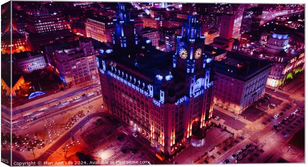 Aerial night view of an illuminated historic building in an urban setting with city lights in Liverpool, UK. Canvas Print by Man And Life