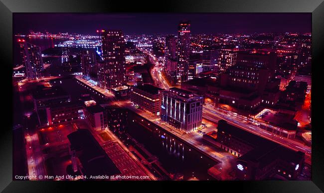 Aerial night view of a bustling cityscape with illuminated streets and urban architecture in Liverpool, UK. Framed Print by Man And Life