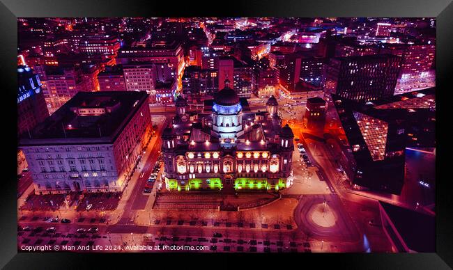 Aerial night view of a vibrant cityscape with illuminated buildings and streets in Liverpool, UK. Framed Print by Man And Life