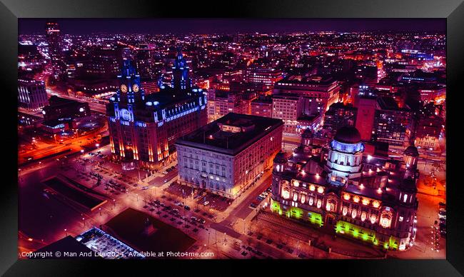 Aerial night view of a vibrant cityscape with illuminated buildings and streets in Liverpool, UK. Framed Print by Man And Life