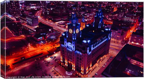 Aerial night view of an illuminated historic building amidst city streets with vibrant red traffic trails in Liverpool, UK. Canvas Print by Man And Life