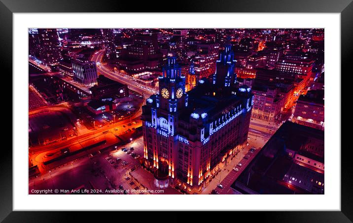 Aerial night view of an illuminated historic building amidst city streets with vibrant red traffic trails in Liverpool, UK. Framed Mounted Print by Man And Life