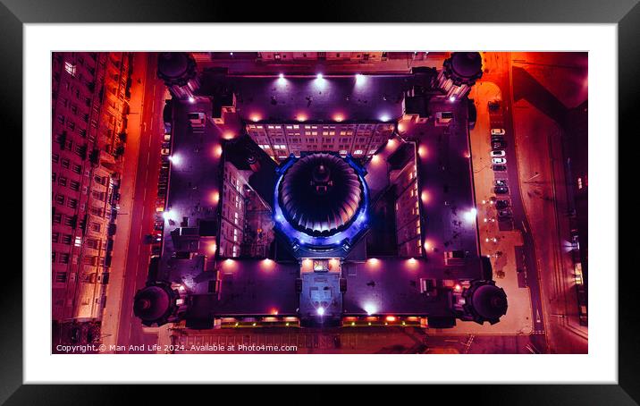 Aerial night view of a cityscape with illuminated streets forming a grid around a circular building in Liverpool, UK. Framed Mounted Print by Man And Life